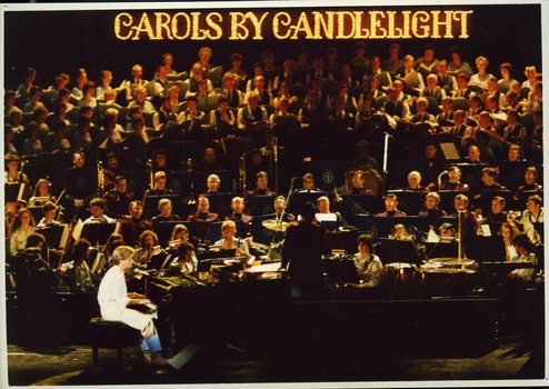 Simon Gallaher singing and playing piano on stage