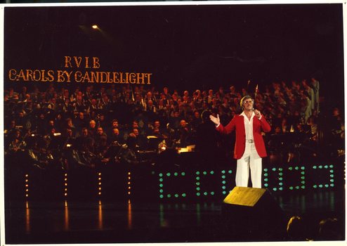 Robert Colman singing on stage