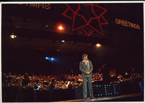John Diedrich singing on stage