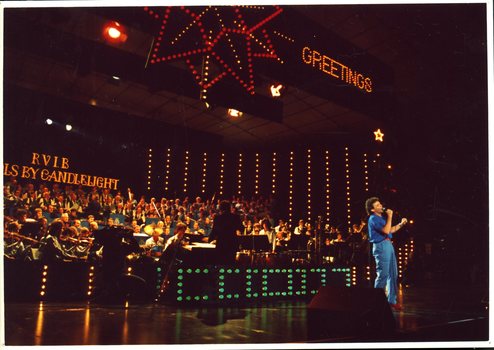 Normie Rowe singing on stage