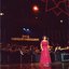 Joan Carden singing on stage