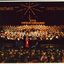 Richard Casey in front of the choir and orchestra on stage
