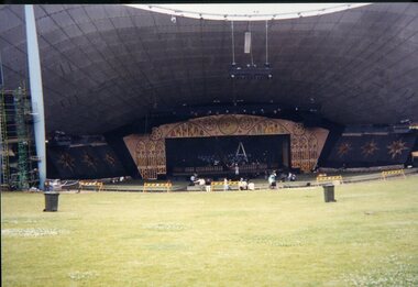People setting up the stage and audience area for Carols