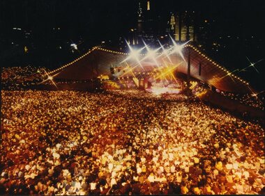 Melbourne city skyline with Carols and audience at night