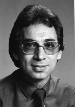 Portrait of man in shirt and tie, wearing glasses