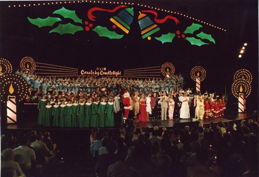 Brian Naylor, choirs and artists gather on stage for the final song