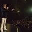 John Lidgerwood sings to the crowd at the front of the stage
