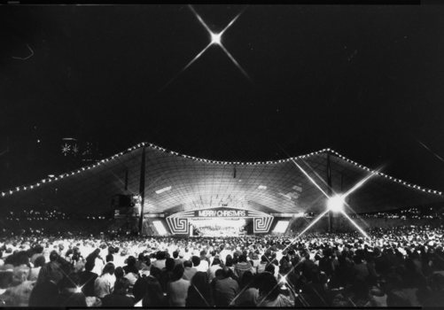 View of 1986 Carols stage, bright star above and some of Melbourne skyline