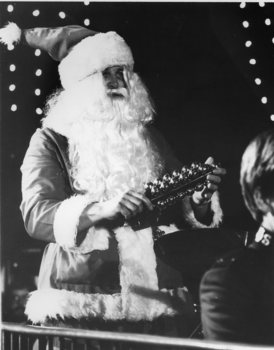 Santa plays the bells at the rear of the Salvation Army Band