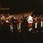 Santa on stage with little drummer boys