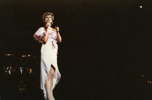 Joan McInnes singing on stage