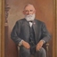 Framed portrait of a seated man.