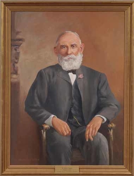 Framed portrait of a seated man.