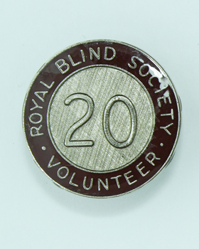 Round badges with '20' on silver cross hatched background