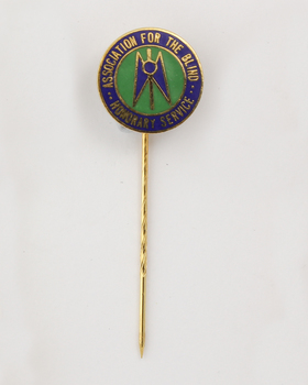 Guiding Light symbol on green background with 'Association for the Blind honorary service' around the edge