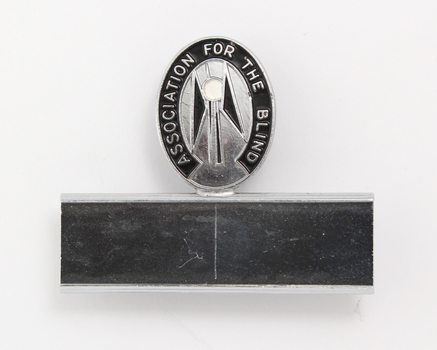 Silver and black guiding light logo with silver name plate underneath