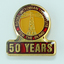 50 Years Badge - Gold lighthouse with red and yellow background