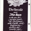 Black and white holly and Christmas bells above and below Christmas message from The Herald and The Sun