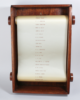 Very pale satin printed with names loosely stretched between two wooden rods encased in a box