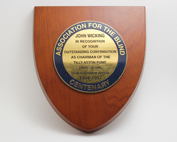 Wooden crest with round plaque attached 