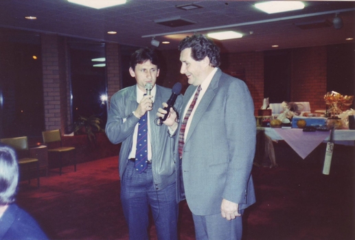 Bob Davis speaking to a younger man