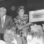Lou Richards spruiks a painting at the auction