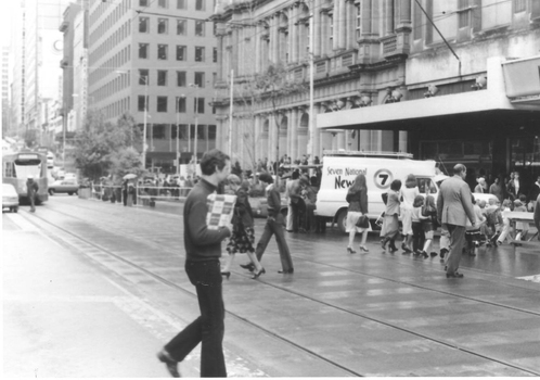 Channel 7 News van and people in Bourke St mall