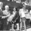 Five people holding A3 papers for White Cane Day: unknown, John Wilson, unknown, John Cook, Lindsay McMillan