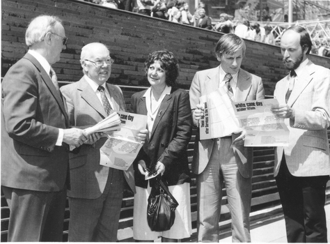 Five people holding A3 papers for White Cane Day: unknown, John Wilson, unknown, John Cook, Lindsay McMillan
