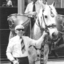 Man with white cane holding Gendarme's bridge