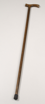 Brown polished wooden cane with handle
