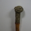 Wooden stick with ornate handle tip