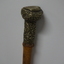 Wooden stick with ornate handle tip