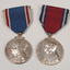 2 silver medals hanging from a red or blue ribbon with blue or red and white edging