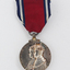 Red ribbon with hanging silver medal
