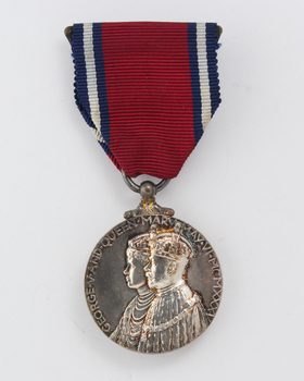 Red ribbon with hanging silver medal