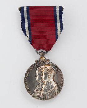 Red ribbon with hanging silver medal