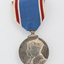 Blue ribbon with hanging silver medal