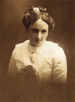 Young woman wearing white blouse and flower in her hair