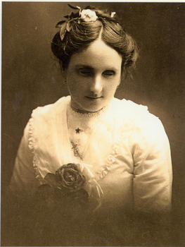 Young woman wearing white blouse and flower in her hair