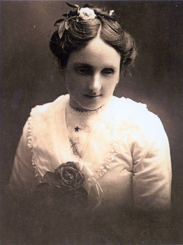 Young woman wearing white blouse and flower in her hair