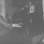 Woman playing organ whilst another woman listens