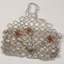 Beaded evening bag with red flowers