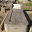 Concrete grave surroundings with stone inlay and white marble plaque
