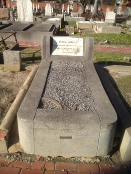 Concrete grave surroundings with stone inlay and white marble plaque