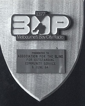 Wooden shield with 3MP logo and 'presented to' plaque attached