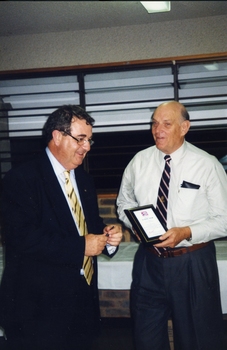 John Puttick presenting Basil Shaw with his award
