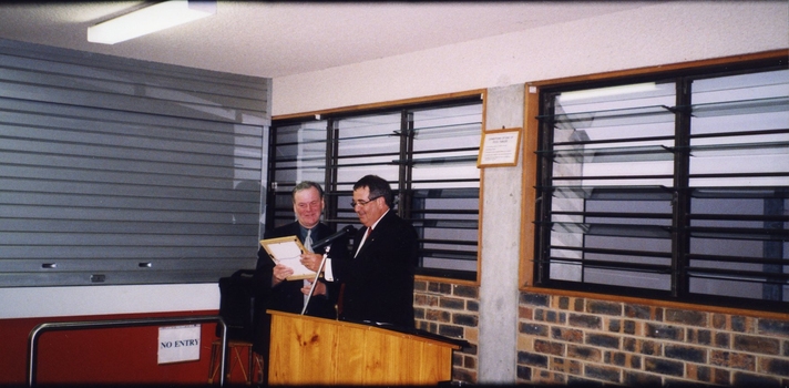 John Puttick presenting an award to Geoff Melvin