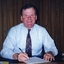 Geoff Melvin, Board Lawyer, at a desk