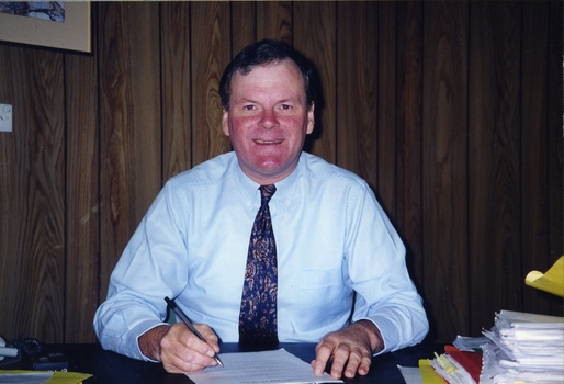 Geoff Melvin, Board Lawyer, at a desk